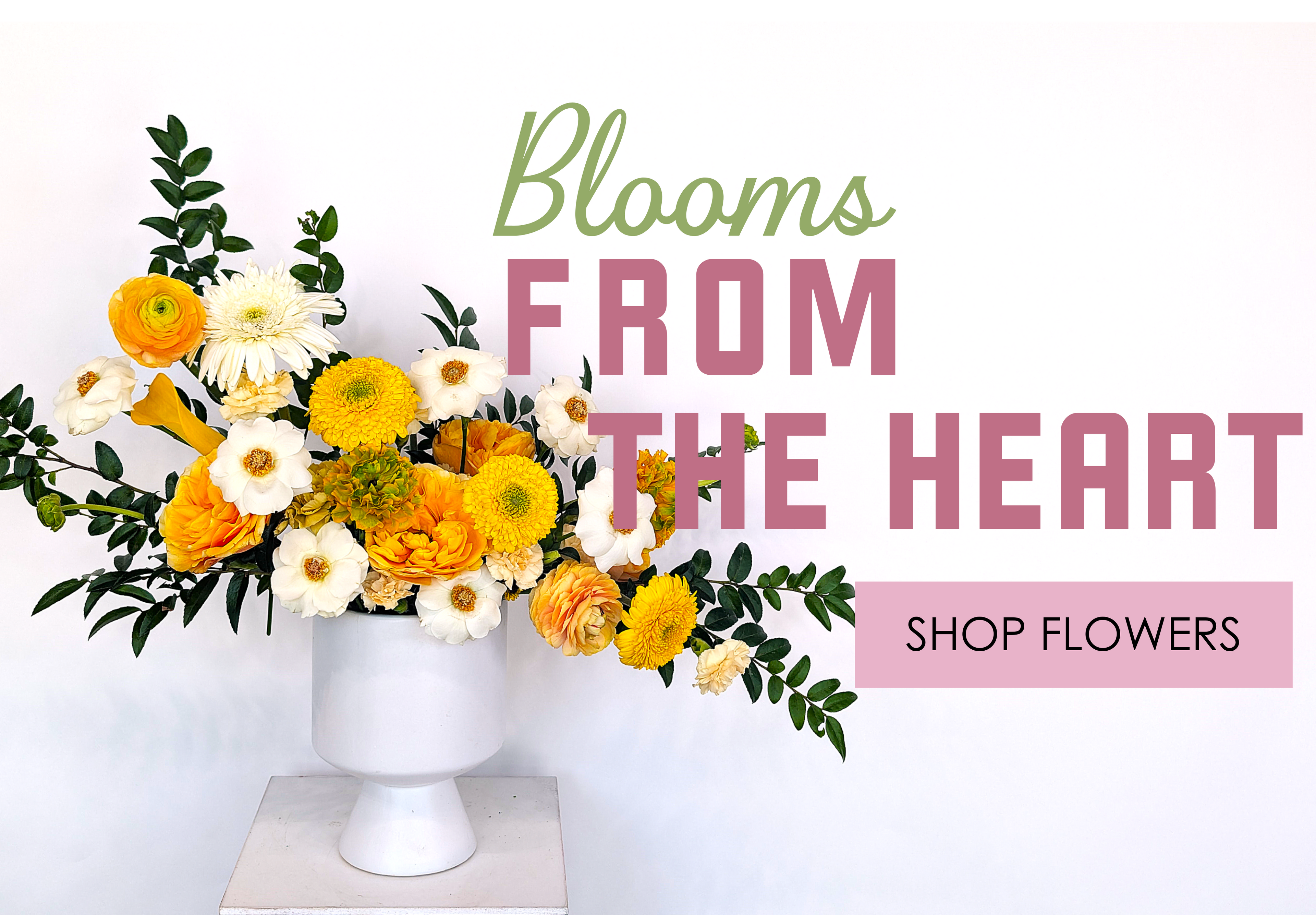 Floral arrangement in a white vase with 'Blooms from the Heart' text and a call to action to shop flowers.