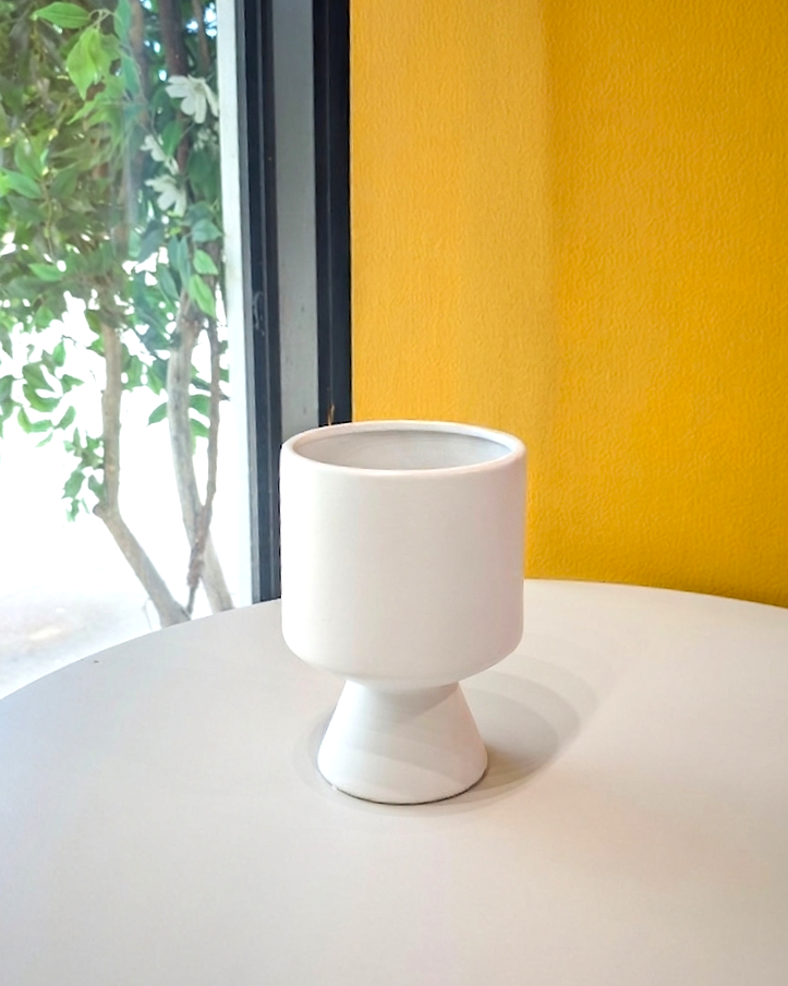This compote Vase collection is unique from silhouette to finish. The vase is glazed and perfect for lush, garden-style arrangements.